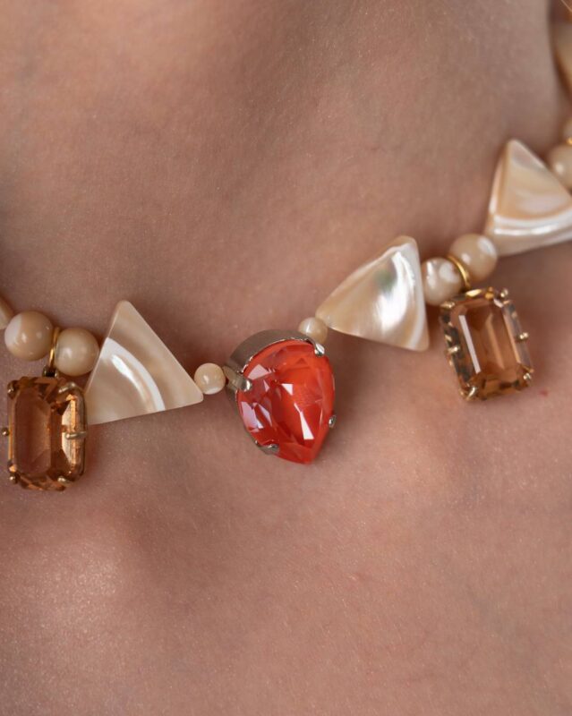 Luna di Cappuccino Necklace featuring mother of pearl stones, champagne Swarovski crystals, and a warm orange pendant