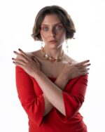 Luna di Seta Cappuccino set featuring mother of pearl stones, champagne Swarovski crystals, and a warm orange pendant on sterling silver