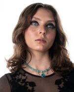 LunaSol Necklace featuring Tiffany cat-eye stones, a majestic blue Swarovski crystal, and a sterling silver moon and sun motif pendant