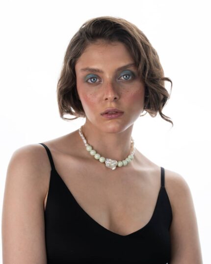 Verdelle Necklace featuring natural freshwater pearls, a pearl pendant, and Swarovski pastel green crystals