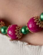 Handcrafted Emerald Blossom Necklace featuring fuchsia jade and emerald-inspired green crystals