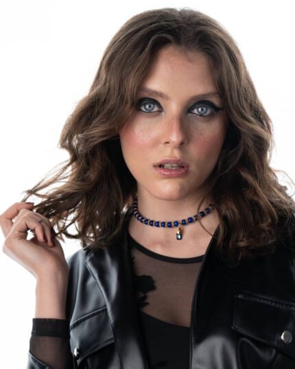 A handcrafted Egypt-Inspired Dark Blue Necklace featuring cat’s eye stones, Swarovski crystals, and black accents.
